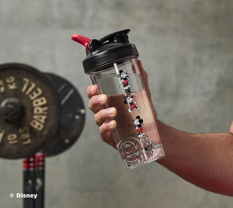 pro-series-j1 Mickey_Mouse_Protein_Shaker_Bottle_Being_Held_In_the_Gym.jpg